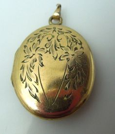 "For sale: (1) s895 Vintage Gold Filled Oval Cabochon Floral Etched Locket Pendant PLEASE READ ENTIRE DESCRIPTION BEFORE PURCHASING Pre-owned item. Good condition. Please see pictures for details. Sold as is, as seen on pictures.We always test all metals, no matter if stamped or not. Perfect for daily wear. Would be a nice anniversary, birthday, Christmas, Mother's Day or Valentine's Day gift for her. This beautiful oval art nouveau features floral engraving in yellow gold filled metal,with plac Cheap Vintage Oval Pendant Necklaces, Luxury Engraved Oval Cabochon Jewelry, Floral Engraving, Locket Necklace Vintage, Valentines Day Gifts For Her, Necklace Vintage, Not Perfect, Saint Louis, Wristwatch Men