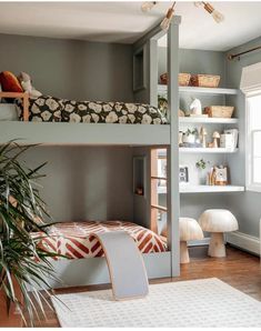 a bedroom with two bunk beds and a rug in front of the bed is an area rug that has been placed on the floor