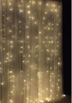 the curtains are covered with lights in the dark