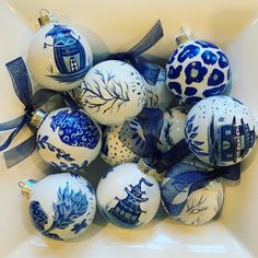 blue and white christmas ornaments in a bowl