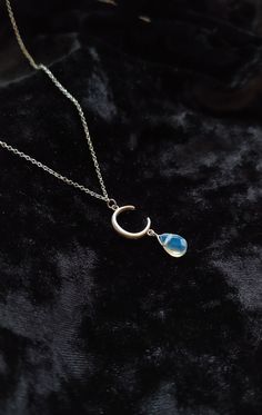 Moon Witch. Βeauty and magic in the most delicately dark way. Iridescent tiny drop that catch the light give a magical vibe to She who wears this piece. This necklace is composed of 925 sterling silver delicate chain, crescent moon and a tiny opalite drop. It makes a gorgeous gift for moon lovers with dark aesthetic!  You can choose between 6 chain lengths: 13 / 14 / 15 / 16 / 17 / 18 inches Not sure which length to buy? We can add a 1 inch extender chain. Just write a note at checkout! ❈ We sen Mystical Teardrop Jewelry For Jewelry Making, Mystical Teardrop Nickel-free Jewelry, Mystical Nickel-free Teardrop Jewelry, Magical Moon Phase Necklace, Magical Sterling Silver Pendant Jewelry, Magical Silver Moon Phase Jewelry, Sterling Silver Teardrop Necklace With Moon Charm, Magical Sterling Silver Moon Phase Jewelry, Sterling Silver Pendant Crystal Necklace With Moon Charm