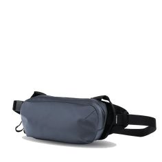 The WANDRD D1 Fanny Pack is a versatile bag that can be worn on your hip or cross-body style. With dedicated organization for things like your phone, keys, and wallet, and enough space to fit a small camera, this is one badass minimal carry solution. Features: Shoulder Carry Waist Carry Phone Pocket Fidlock Magnetic Buckle Dual Side Handles Small Camera Carry Cash/Passport Pocket Key Clip Weather Resistant YKK Zippers Internal Organization Specs: Dimensions: 5"H X 9"W X 2.5"D Volume: 2 L Weight: Functional Blue Belt Bag For Travel, Functional Blue Belt Bag With Cell Phone Pocket, Versatile Chest Bag For Commuting With Cell Phone Pocket, Versatile Commuting Chest Bag With Cell Phone Pocket, Versatile Chest Bag With Cell Phone Pocket For Commuting, Modern Blue Belt Bag For Travel, Modern Blue Bag With Functional Pockets, Blue Travel Belt Bag For Mobile Phone, Blue Mobile Phone Belt Bag For Travel