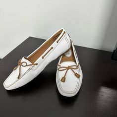 White Moccasins , Never Been Worn. Perfect Condition!!! White Loafers With Stitched Sole, White Leather Moccasins With Removable Insole, White Almond Toe Moccasins With Rubber Sole, White Leather Moccasins With Almond Toe, White Leather Almond Toe Moccasins, Elegant Spring Boat Shoes With Round Toe, White Moccasins With Rubber Sole For Spring, White Moccasins With Flat Leather Sole, White Moccasins With Leather Sole And Flat Heel