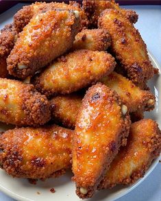 some fried food is on a white plate and ready to be eaten by someone else