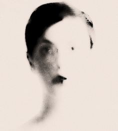 a black and white photo of a woman's face