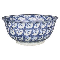 a blue and white bowl sitting on top of a table