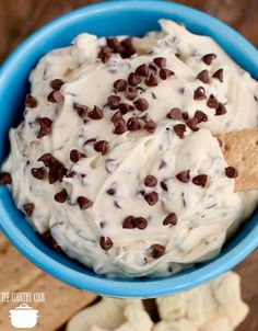 a blue bowl filled with cookies and cream