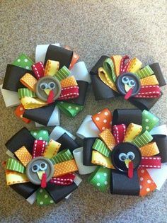 several turkey hair clips are arranged on the floor, one with a button in it's center