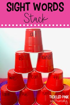 a stack of red plastic cups with the words sight words stacked on top