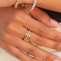 elevate your ring stack with our Sunset Lover Ring Stack. this premium set creates endless possibilities to elevate your jewelry capsule collection. wear each band individually or stack them together for a touch of luxury. the perfect addition for a sophisticated and minimal look. 18K gold pvd over 316L stainless steel water & tarnish resistant each band is 2mm thick set of 3 bands 1 cz bezel band, 2 solid bands Stackable Adjustable Eternity Band For Everyday, Everyday Stackable Diamond Ring With Round Band, Everyday Stackable Ring Bands, Adjustable Minimalist Yellow Gold Eternity Band, Gold Minimalist Stackable Eternity Band, Everyday Gold Stackable Bands, Adjustable Minimalist Stackable Eternity Band, Minimalist Adjustable Stackable Eternity Band, Everyday Stackable Gold Bands