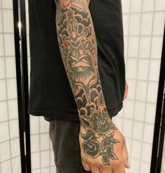 a man with a tattoo on his arm