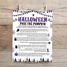 a halloween pass the pumpkin game on a wooden background with bats and spider webs