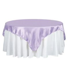 a round table covered with a purple and white satin tablecloth on a white background