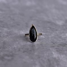 ✦ Embrace the mystique of the Bohemian long black onyx Ring. Skillfully set in a design imbued with bohemian spirit, this ring flaunts a long pear-cut black onyx, offering deep, enigmatic allure. A fusion of free-spirited vibes with the stark beauty of onyx, it's the perfect piece for those drawn to both the wanderlust of bohemia and the strength of the stone. 💎  Please Note As with all Natural Gemstones The colors and inclusion patterns if applicable may vary slightly. -- -- »» DETAILS -  Gemstone -  Black Onyx Metal - 925 Sterling Silver -- -- »» $ BU Y * M O R E * S A V E * M O R E $ «« ✦ Special 25% OFF when you order 2 items!! Apply Coupon Code: SAVEMORE25 ✦Special 30% OFF when you order 3 or more items!! Apply Coupon Code: SAVEMORE30 -- -- C O M P L E T E * T H E * L O O K ✦ Earring Black Teardrop Gemstone Jewelry, Black Teardrop Bohemian Jewelry, Black Pear-shaped Jewelry As Gift, Black Teardrop Wedding Rings, Black Pear-shaped Jewelry Gift, Black Pear-shaped Jewelry For Gift, Black Teardrop Rings For Gift, Black Teardrop Ring For Gift, Classic Black Pear-shaped Jewelry