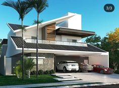 two cars are parked in front of a modern style house with palm trees and landscaping