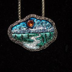 This Necklace Is Made From A Pewter Blank And Hand Enameled By Me. It Is A Bright Silver Nickel Free Pendant And Chain. The Pendant Is An Organic Shaped Oval With A Summer Landscape Stamped Into It. There Is An Amber Colored Round Crystal Sun In The Blue Sky. The Mountains Underneath Are Snow Capped And The Silver River Flows Out Onto The Green Plains With Trees. The Pendant Is 1 1/2" Wide By 1 1/8" Tall. The Chain Is A Box Type With A Lobster Claw Clasp. The Necklace Is 24" Long And Has A Lobst Hand Painted Silver Jewelry As Gift, Unique Hand Painted Silver Jewelry, Hand Painted Metal Jewelry Gift, Hand Painted Metal Jewelry As Gift, Hand Painted Metal Jewelry As A Gift, Hand Painted Silver Necklace For Gift, Nickel Free Enamel Pendant Necklace, Hand Painted Silver Enamel Jewelry, Silver Necklace With Black Enamel In Distinctive Style