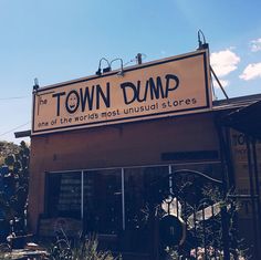 an old town dump store with the sign above it