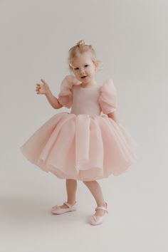 Introducing the Maria Kids Dress: a delightful blush pink flower girl dress crafted from delicate puff organza, perfect for making your little one feel like a princess. This charming dress is designed with attention to detail, ensuring both comfort and style for any special occasion. The Maria Kids Dress features adora Organza Baby Frocks, Organza Dress For Kids, Modern Flower Girl Dress, Organza Frocks For Kids, Party Dress For Kids, Organza Flower Girl Dress, Blush Flower Girl Dresses, Pink Flower Girl Dresses