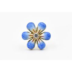 This pair of blue enamel daisy earrings are part of the daisy line, a beautiful handmade line of jewelry by Sandra J. Sensations. Each flower is hand painted by an enamel artist. The flowers are 14k with diamonds in the center. Each diamond is approximately .07 carats so the total diamond weight is .14 carats atw. Each flower in solid gold and has a post back.   They come in purple, yellow, pink and blue.  If we do not have it currently in stock it takes up to 8 weeks to order. Unique Enamel Flower Shaped Jewelry, Unique Enamel Flower Jewelry, Flower-shaped Enamel Ring For Gift, Flower-shaped Enamel Ring As Gift, Flower Shaped Enamel Ring For Gift, Floral Enamel Ring As Gift, Flower Shaped Enamel Ring As A Gift, Flower-shaped Enamel Flower Earrings For Gift, Blue Enamel Flower Earrings As Gift