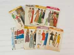 four vintage sewing books with different patterns on them