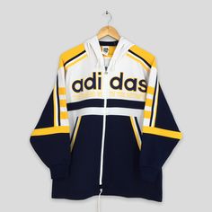 Vintage 90s Adidas Trefoil Track Top Jacket Large Unisex Adidas Sportswear Multicolor Track Top Zipper Jacket Adidas Hoodie Sweaters Size L by slayvin on Etsy Hoodie Track Jacket For Streetwear, Streetwear Sportswear Track Jacket With Hoodie, Retro Fall Sports Hoodie, Retro Fall Hoodie For Sports, Hooded Track Jacket With Three Stripes For Fall, Retro Sports Hoodie For Winter, Sportswear Track Jacket With Double-lined Hood For Streetwear, Throwback Winter Track Jacket For Sports, Sporty Hooded Jacket For College