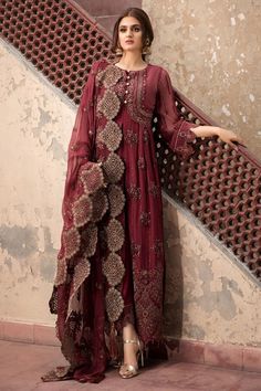 Chiffon Party Outfit in Maroon Color in Elegant Design emblazoned with thread embroidery in Pretty design. Chiffon dresses are available online at this store. You can wear these chiffon dresses on Party, Wedding and Eid events. Frock: Chiffon Party outfit frock in maroon color is embellished with copper thread hand embroidered front, back , side and neckline patch. Front and back daman is also designed with hand embroidered patch. Bottom and sleeves of the dress is embellished with embroidered h Pakistani Designer Dress, Estilo Hijab, Indian Party Wear, Pakistani Dresses Casual, Pakistani Fashion Party Wear, Outfits Dress, Salwar Kamiz, Pakistani Bridal Dresses, Designer Party Wear Dresses