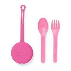 pink utensils and spoons on a white surface with a heart drawn on the handle