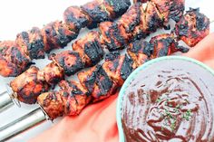 barbecue skewers with bbq sauce on the side