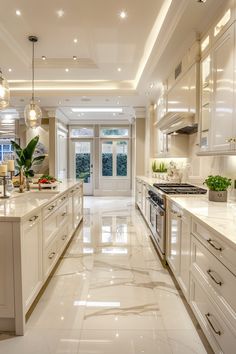 a large kitchen with marble floors and white cabinets