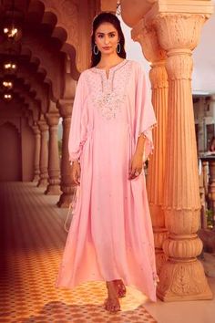 Powder pink kaftan with geometric hand embroidery using multi colored thread, mirror, beads work. Paired with an inner slip dress. - Aza Fashions Pink Resham Embroidery Kaftan For Festivals, Pink Anarkali Kaftan For Navratri, Pink Resham Embroidery Kaftan For Diwali, Pink Traditional Drape Kaftan For Festivals, Pink Kaftan For Diwali, Pink Anarkali Kaftan For Festive Occasions, Designer Pink Kaftan For Diwali, Designer Georgette Kaftan With Mirror Work, Unstitched Kaftan With Mirror Work For Navratri