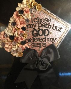 a graduation cap decorated with flowers and the words i choose my path but god doesn't say