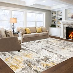 a living room filled with furniture and a fire place in the middle of the room