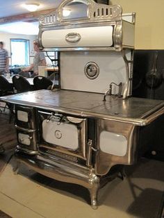 an old fashioned stove sitting on display in a room