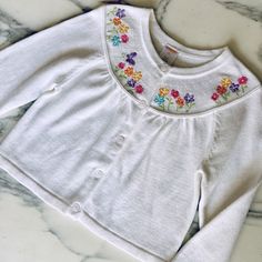 Nwt-New! White Sweater With Bright Colored Flowers And Butterflies Embroidered At The Collar/ Neckline. Embroidery On Front And Back. Cardigan Style With Buttons Down The Front. So Sweet For Fall Or Spring! Bright Colored Flowers, Princess Closet, Neckline Embroidery, Cardigan Style, Flowers And Butterflies, Colored Flowers, Embroidered Cardigan, Bright Colored, Cardigan Fashion