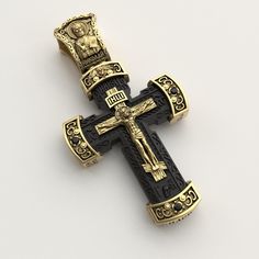 Gold Orthodox cross  All parcels are insured, you receive it by courier in person ✔️Black ebony tree ✔️Sstones can be optional ✔️Production is possible in two sizes: ✔️Weight +- 12-13 grams ✔️Size 50/28 (including the ear) 🔘On the cross is depicted:   🔘Jesus Christ   🔘Mikola the Wonderworker   🔘Virgin Mary   🔘Guardian Angel and the full prayer "Our Father" If you have any additional questions, please write to me and I will be happy to answer them. Luxury Cross Pendant Necklace, Black Engraved Pendant Cross Necklace, Black Engraved Cross Jewelry, Handmade Black Crucifix Necklace, Black Engraved Cross Necklace Gift, Engraved Black Cross Necklace As Gift, Engraved Black Cross Necklace For Gift, Gift Black Engraved Cross Necklace, Luxury Pendant Cross Necklace Gift