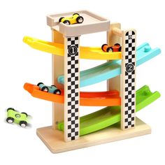 a wooden toy set with cars and ramps on it's sides, in front of a white background