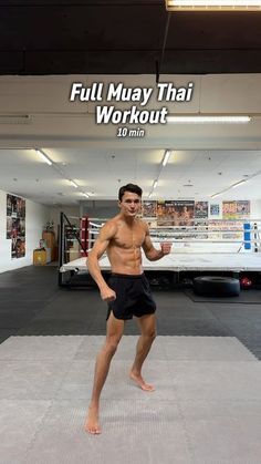 a man standing on top of a mat in front of a white wall with the words full muay thai workout