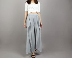 * Beautiful pearl chiffon pants, very comfortable to wear, not easy to get wrinkled, very easy to take care of.* Add an asymmetric layer on the front, very unique and beautiful.* Material: outer-pearl chiffon, lining-100% polyesterCustom made to fit, lead time is 6-8 days;Let us know your usual size in your country and your overall height.If you have some specific request or special characters such as broad shoulder, long arms, long waist, etc you think we need pay attention to when making, do l Summer Chic Baggy Harem Pants, Elegant Baggy Bottoms For Summer, Elegant Baggy Summer Bottoms, Elegant Solid Harem Pants For Spring, Solid Color Elegant Harem Pants For Spring, Versatile Long Skirt For Summer, Casual Chiffon Wide Leg Pants, Chic Chiffon Wide Leg Pants For Summer, Elegant Spring Harem Pants With Elastic Waistband