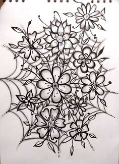 a drawing of flowers and leaves on a piece of paper with pencils in it