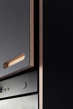 a close up of a drawer with a mirror on the bottom and light at the top