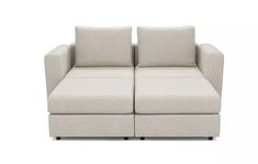 two white couches sitting next to each other on a white surface with black legs