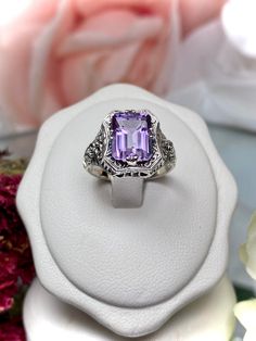 Natural Purple Amethyst Ring  Lovely Rectangle Design#148 Made To Order Make heads turn and stand out with this gorgeous piece of jewelry! This Edwardian reproduction filigree ring is made from sterling silver, and features an emerald cut high quality natural genuine purple amethyst gemstone measuring 9mm by 7mm (approximately 2.88 ct). From the beautiful intricate floral daisy design to the inside of the band marked 925 for sterling silver - this ring will take your look to the next level! Plus Luxury Sterling Silver Amethyst Birthstone Ring, Luxury Sterling Silver Amethyst Ring With Center Stone, Luxury Heirloom Amethyst Sterling Silver Ring, Luxury Heirloom Amethyst Ring In Sterling Silver, Luxury Lavender Amethyst Ring In Sterling Silver, Amethyst Mermaid Ring, Art Deco Rectangular Ring With Accent Stones, Rectangular White Gold Ring With Accent Stones, Rectangular Amethyst Ring With Accent Stones