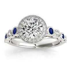 a diamond and blue sapphire engagement ring