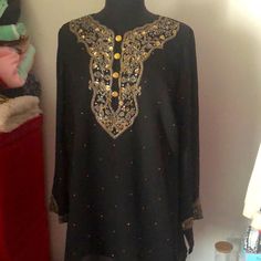 Romans Women’s Tunic Long Sleeve Blouse With Embellished Glued Dots And Stitched Sequins. Accent Buttons Polyester Lining. New Traditional Festive Embellished Tunic, Festive Traditional Embellished Tunic, Elegant Tunic With Zari Work For Eid, Elegant Eid Tunic With Zari Work, Elegant Tunic Top For Eid, Elegant Eid Tunic Top, Traditional Festive Tunic For Party, Long Sleeve Embellished Festive Tunic, Festive Embellished Long Sleeve Tunic