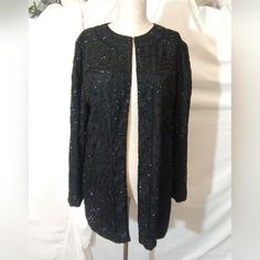 Brilliante Size: Small Material:. Silk Color: Black Measurements:. 37-In Bust 30 Inch Length Style:. Women Designer Light Weight Sweater-Jacket. Round Neck, Open Closure Long Sleeves Sparkle Beaded Design With Black Beads On Black Silk. Long Sleeves Condition:. New Without Tags. There Are No Blemishes, Stains, Loose Threading Or Snags. Excellent. Embellished Evening Cardigan For Fall, Beaded Winter Outerwear For Formal Occasions, Beaded Outerwear For Night Out In Fall, Fall Night Out Beaded Outerwear, Fall Evening Embellished Cardigan, Fall Beaded Outerwear For Night Out, Beaded Long Sleeve Outerwear For Fall, Beaded Fitted Outerwear For Night Out, Beaded Evening Outerwear For Winter