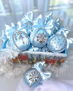 a basket filled with blue ornaments on top of a table