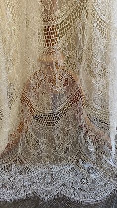 "Chantilly lace cape in off-white shade Unique fabric design with a chandelier-like motif giving an Art Deco vibe Fitted shoulders with soft gathers The cape is edged with eyelash scallop edge - very feminine Finished length is 60\" from shoulders A one-of-a-kind design💕" Long Sheer Lace Dress, Sheer Lace Dress For Mother Of The Bride, White Lace Dress For Mother Of The Bride, Wedding Dress Coverup, White Sheer Lace Dress, Gown Cape, Cape Veil, Lace Coat, Lace Cape