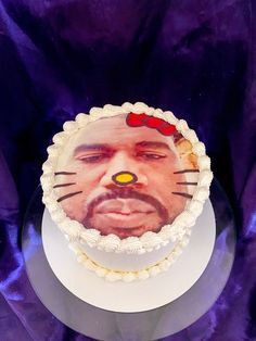 a cake with a photo of a man's face on it