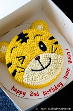 a birthday cake in the shape of a tiger