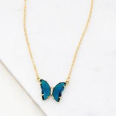 Shine in this playful acrylic butterfly necklace. Features transparent gem tone wings with crystal sparkle body. Measures 16" + 3" extension.Butterfly .5" x .75" Butterfly Charm Necklace For Party, Acrylic Butterfly, Gem Tones, Global Village, Butterfly Pendant Necklace, Green Necklace, Butterfly Necklace, Butterfly Pendant, Violet